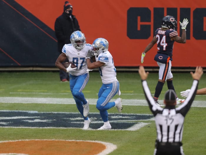 Cephus is congratulated for scoring a touchdown against the Chicago Bears.